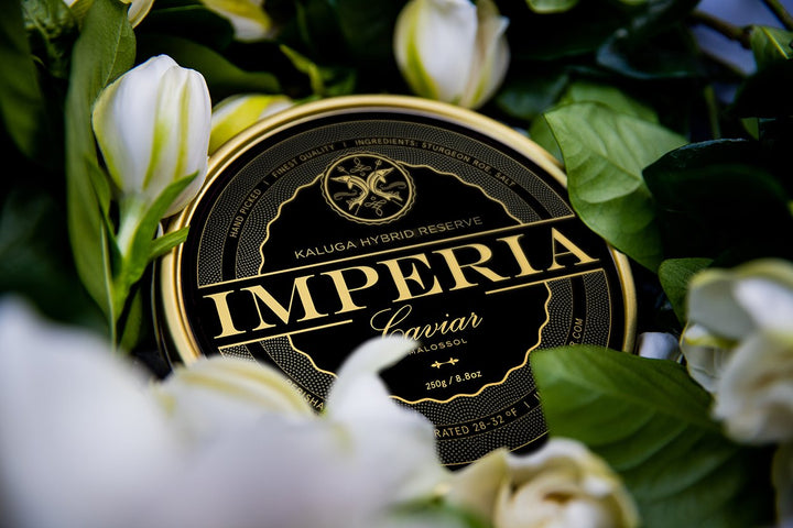 Imperia Caviar tin in a bed of white flowers