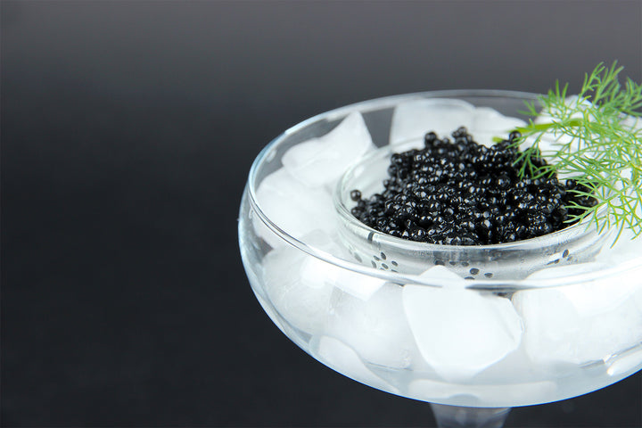 Caviar sitting in a glass full of ice