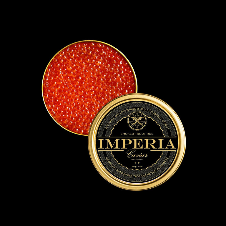 Open Imperia Smoked Trout Roe tin showing bright orange pearls with the branded lid on a black background.
