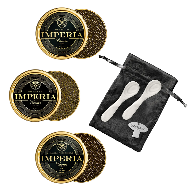 Imperia Caviar tins with caviar and a black pouch with mother-of-pearl spoons and caviar tin opener on a black background