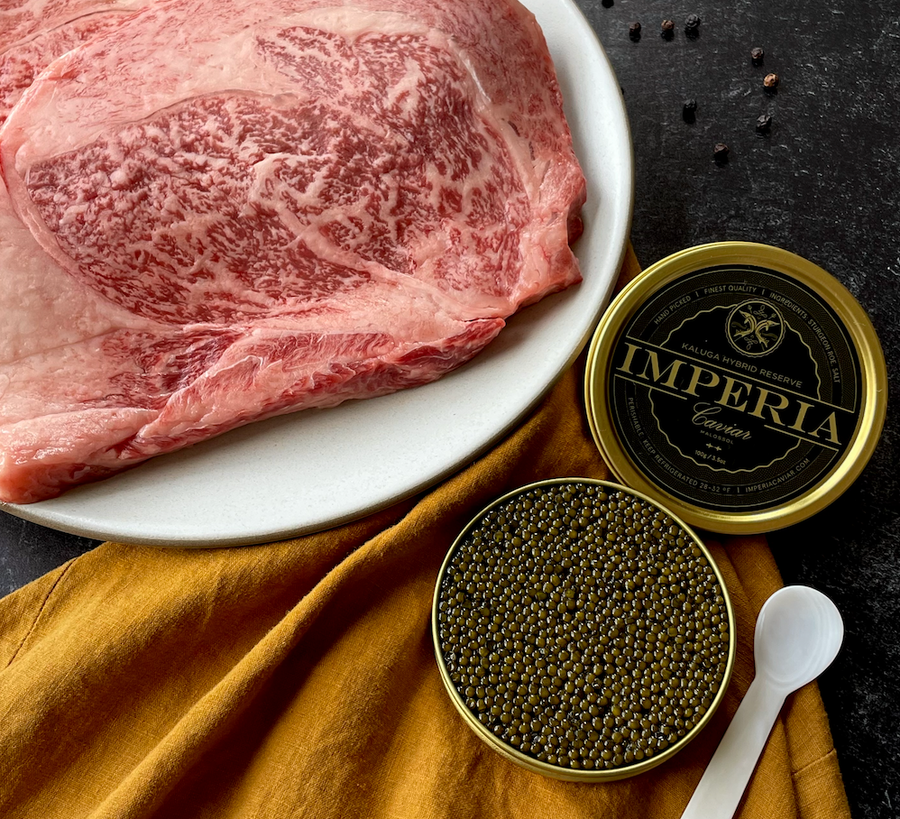 Wagyu beef on plate and tin of caviar
