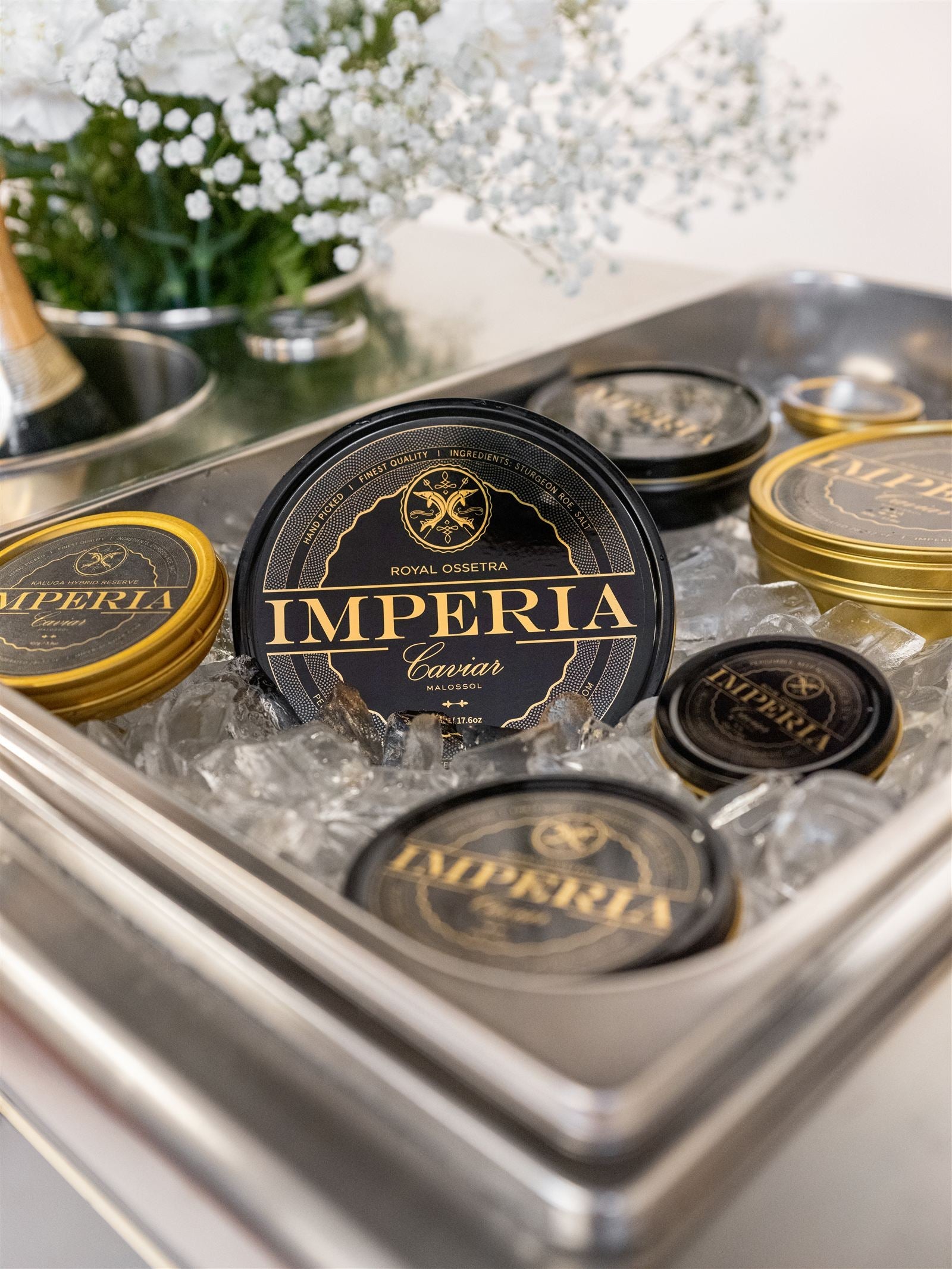 Imperia Caviar tins on ice for service